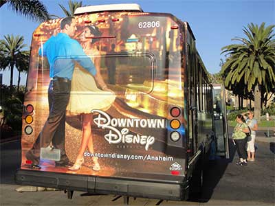 Advertisement on the back of a bus with a couple dancing