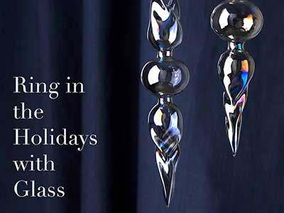 Glass ornaments against a blue velvet background with the text 'Ring in the Holidays with Glass'